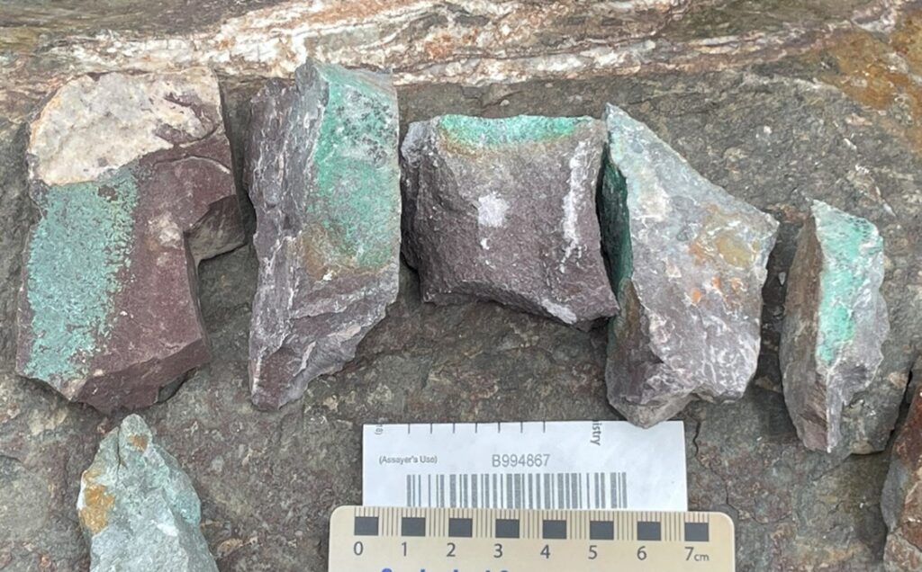 Photo 2: Secondary copper staining on volcaniclastic conglomerate boulders, Red Line 2 claim.